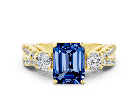 Yellow gold Emerald Cut Blue Sapphire Three-Stone Ring with Pavé Split Shank and Four-Prong Setting