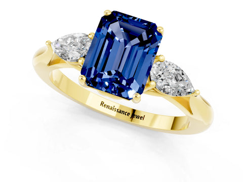 Yellow gold Emerald Cut Blue Sapphire Three-Stone Ring with Pear Side Stones and Four-Prong Setting_13