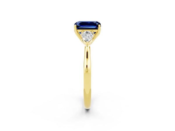 Yellow gold Emerald Cut Blue Sapphire Three-Stone Ring with Pear  Side Stones and Prong Setting