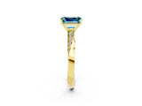 Yellow gold Emerald Cut Blue Topaz Engagement Ring with Side Stone Accents and Four-Prong Setting_62