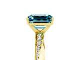 Yellow gold Emerald Cut Blue Topaz Engagement Ring with Side Stone Accents and Four-Prong Setting_65