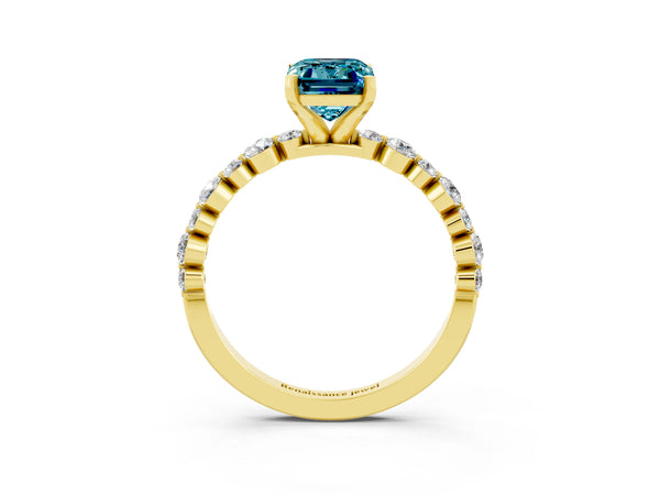 Yellow gold Emerald Cut Blue Topaz Prong Set Engagement Ring with Pavé Band