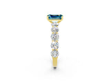 Yellow gold Emerald Cut Blue Topaz Prong Setting with Side Stones on a Pave Band_2