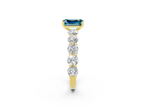 Yellow gold Emerald Cut Blue Topaz Prong Setting with Side Stones on a Pave Band_2