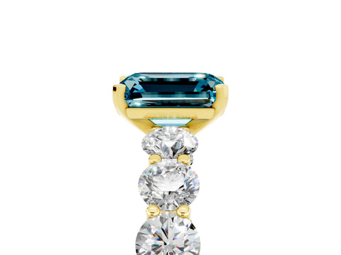 Yellow gold Emerald Cut Blue Topaz Prong Setting with Side Stones on a Pave Band_5