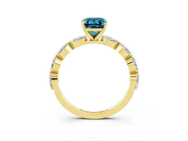 Yellow gold Emerald Cut Blue Topaz Ring with Marquise Side Stones and Prong Setting