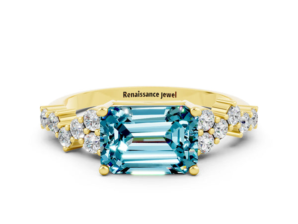 Yellow gold Emerald Cut Blue Topaz Scattered Round Accent Ring with Prong Setting
