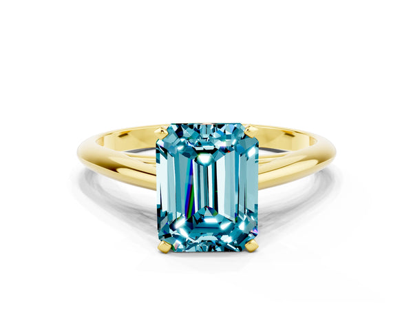 Yellow gold Emerald Cut Blue Topaz Solitaire Engagement Ring with Cathedral Setting and Four-Prong Mount