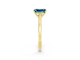 Yellow gold Emerald Cut Blue Topaz Solitaire Engagement Ring with Cathedral Setting and Four-Prong Mount_26