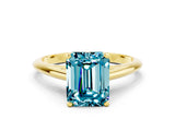 Yellow gold Emerald Cut Blue Topaz Solitaire Engagement Ring with Cathedral Setting and Four-Prong Mount_66