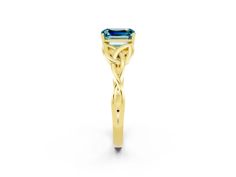 Yellow gold Emerald Cut Blue Topaz Solitaire Engagement Ring with Celtic Knot Band and Four-Prong Setting_2