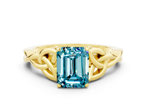 Yellow gold Emerald Cut Blue Topaz Solitaire Engagement Ring with Celtic Knot Band and Four-Prong Setting