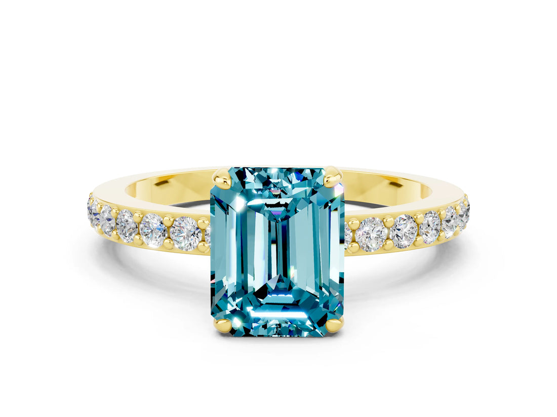 Yellow gold Emerald Cut Blue Topaz Solitaire Engagement Ring with Pavé Band and Four-Prong Setting