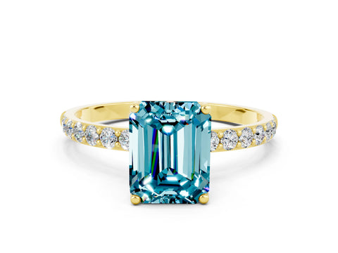 Yellow gold Emerald Cut Blue Topaz Solitaire Engagement Ring with Pavé Band and Prong Setting