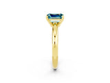 Yellow gold Emerald Cut Blue Topaz Solitaire Engagement Ring with Round Band and Four-Prong Setting_2