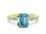 Yellow gold Emerald Cut Blue Topaz Solitaire Pavé Band with Four-Prong Setting