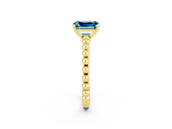 Yellow gold Emerald Cut Blue Topaz Solitaire Ring with Beaded Band and Prong Setting