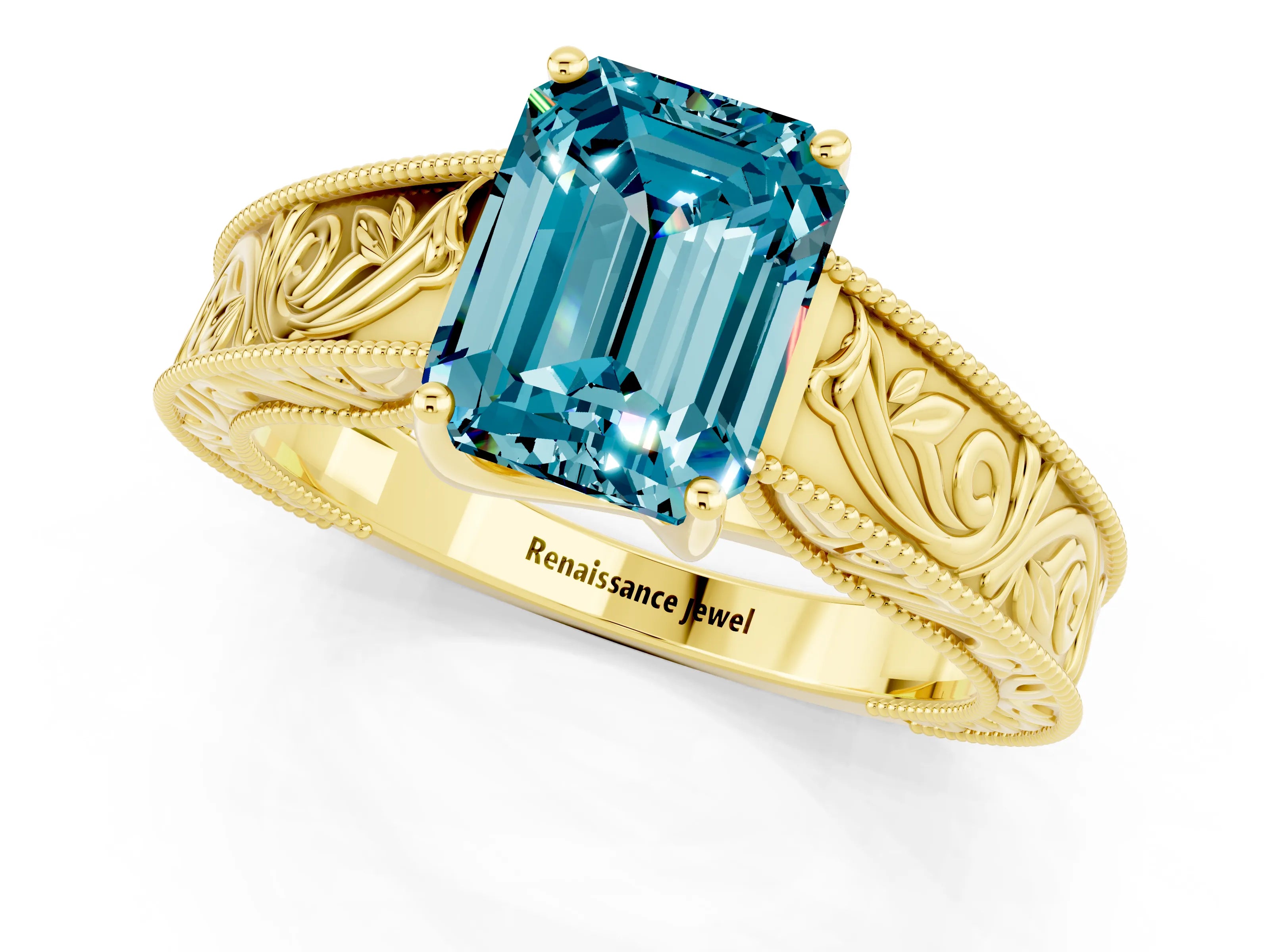Yellow gold Emerald Cut Blue Topaz Solitaire Ring with Engraved Band and Four-Prong Setting_1