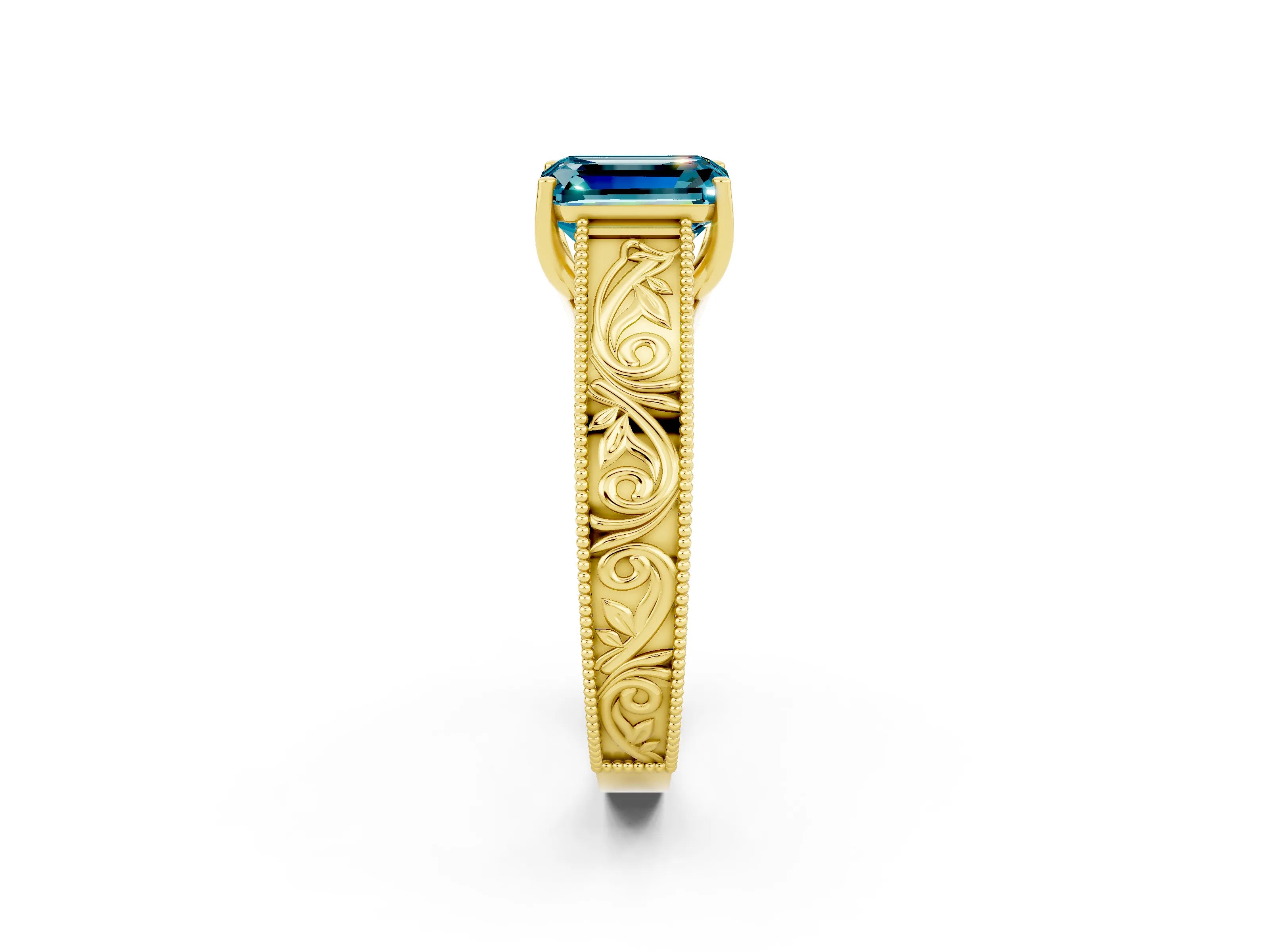 Yellow gold Emerald Cut Blue Topaz Solitaire Ring with Engraved Band and Four-Prong Setting_2