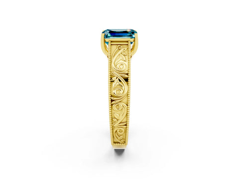 Yellow gold Emerald Cut Blue Topaz Solitaire Ring with Engraved Band and Four-Prong Setting_2