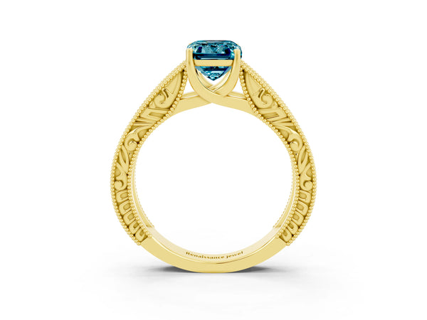 Yellow gold Emerald Cut Blue Topaz Solitaire Ring with Engraved Band and Four-Prong Setting