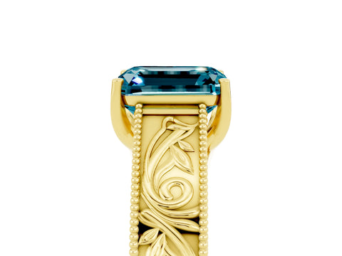 Yellow gold Emerald Cut Blue Topaz Solitaire Ring with Engraved Band and Four-Prong Setting_5