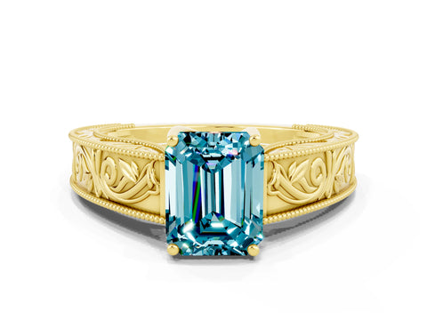 Yellow gold Emerald Cut Blue Topaz Solitaire Ring with Engraved Band and Four-Prong Setting