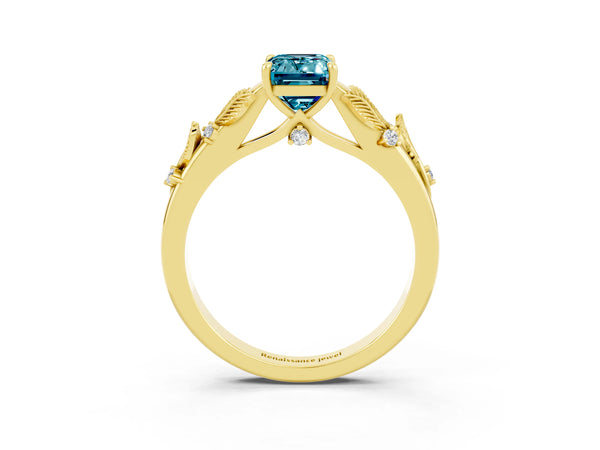 Yellow gold Emerald Cut Blue Topaz Solitaire Ring with Leaf Motif Band and Four-Prong Setting
