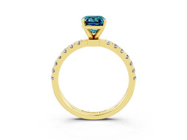 Yellow gold Emerald Cut Blue Topaz Solitaire Ring with Pavé Accents and Four-Prong Setting