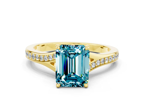 Yellow gold Emerald Cut Blue Topaz Solitaire Ring with Pavé Band and Prong Setting