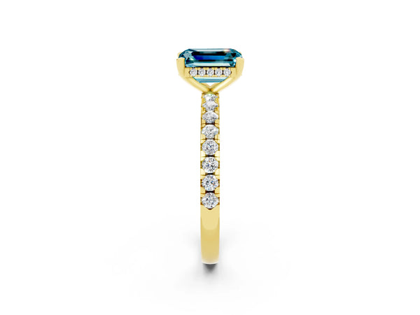 Yellow gold Emerald Cut Blue Topaz Solitaire Ring with Round Pavé Band and Four-Prong Setting