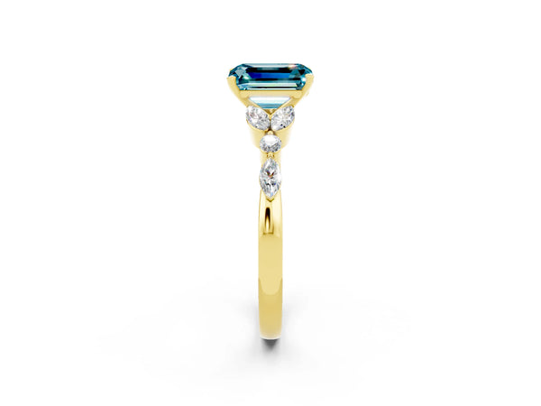 Yellow gold Emerald Cut Blue Topaz Solitaire Ring with Side Stones and Four-Prong Setting
