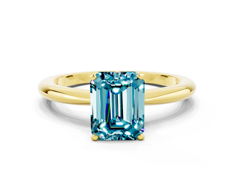 Yellow gold Emerald Cut Blue Topaz Solitaire Ring with Six-Prong Setting and Classic Band