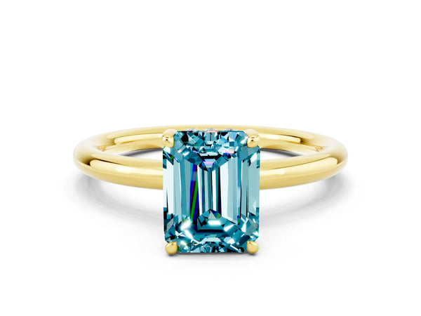 Yellow gold Emerald Cut Blue Topaz Solitaire Ring with Thin Band and Four-Prong Setting