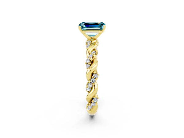 Yellow gold Emerald Cut Blue Topaz Solitaire Ring with Twisted Band and Pavé Accents