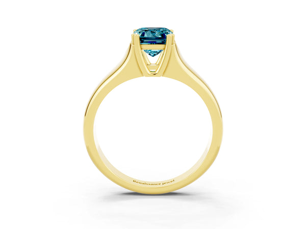 Yellow gold Emerald Cut Blue Topaz Solitaire Ring with Wide Band and Prong Setting