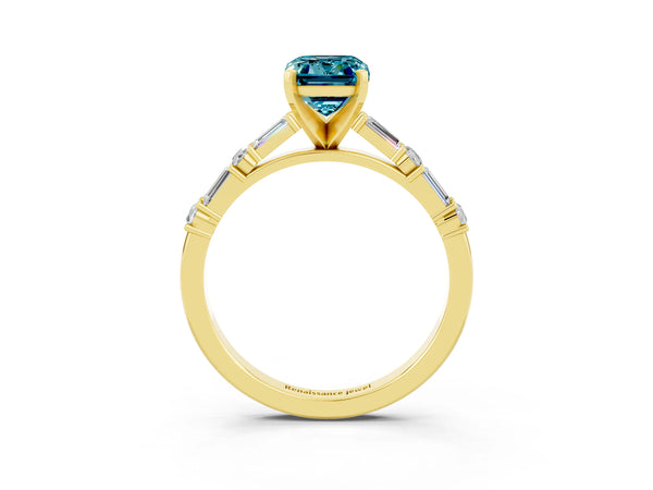 Yellow gold Emerald Cut Blue Topaz Solitaire with Side Baguettes and Channel Set Band
