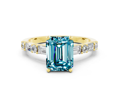 Yellow gold Emerald Cut Blue Topaz Solitaire with Side Baguettes and Channel Set Band