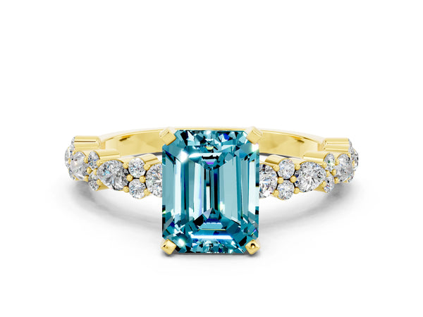 Yellow gold Emerald Cut Blue Topaz Side Stone Solitaire Ring with Round  and Four-Prong Setting