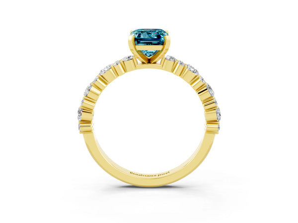 Yellow gold Emerald Cut Blue Topaz Side Stone Solitaire Ring with Round  and Four-Prong Setting
