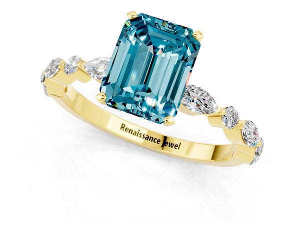Yellow gold Emerald Cut Blue Topaz Ring with Marquise and Round  Side Stones and Four-Prong Setting