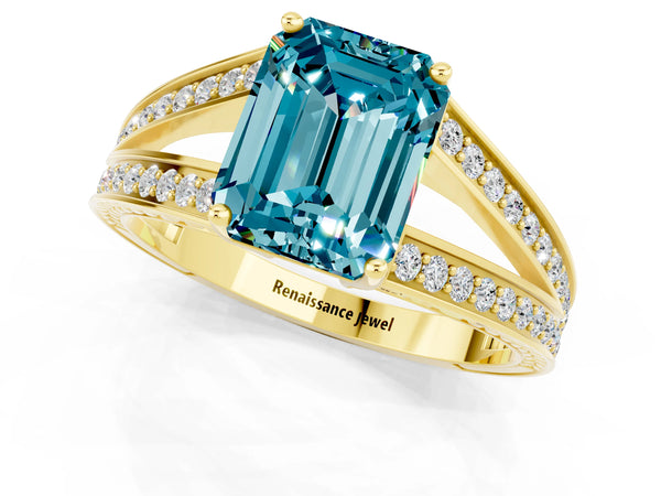Yellow gold Emerald Cut Blue Topaz Split Shank Ring with Pavé Band and Four-Prong Setting