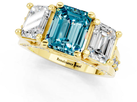 Yellow gold Emerald Cut Blue Topaz Three-Stone Ring with Channel Set Band and Four-Prong Setting_1
