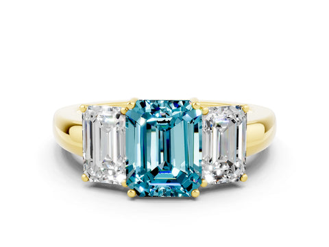 Yellow gold Emerald Cut Blue Topaz Three-Stone Ring with Four-Prong Setting and Classic Band