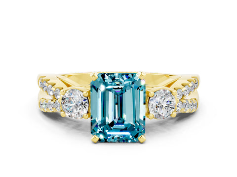 Yellow gold Emerald Cut Blue Topaz Three-Stone Ring with Pavé Split Shank and Four-Prong Setting
