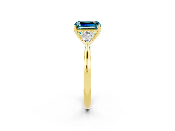 Yellow gold Emerald Cut Blue Topaz Three-Stone Ring with Pear  Side Stones and Prong Setting