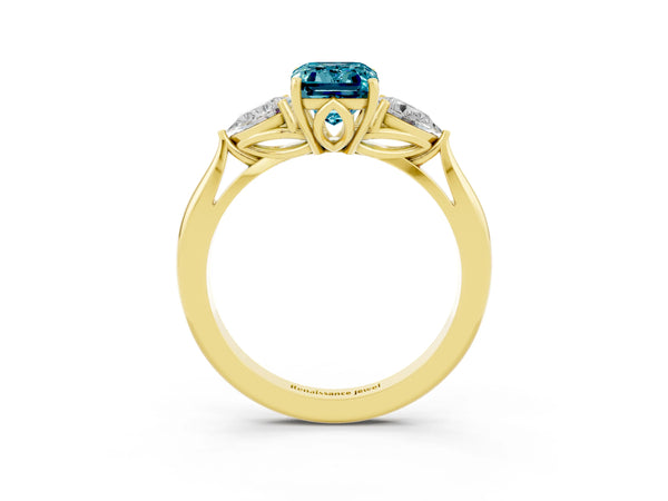 Yellow gold Emerald Cut Blue Topaz Three-Stone Ring with Pear  Side Stones and Prong Setting