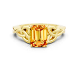 Yellow gold Emerald Cut Citrine Solitaire Engagement Ring with Celtic Knot Band and Four-Prong Setting