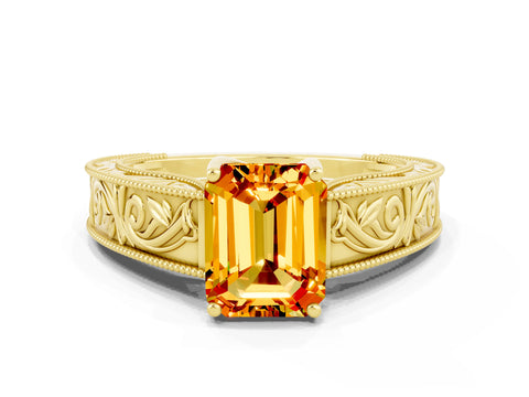 Yellow gold Emerald Cut Citrine Solitaire Ring with Engraved Band and Four-Prong Setting
