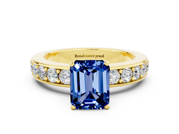 Yellow gold Emerald Cut Blue Sapphire Engagement Ring with Channel Set Round  Band and Prong Setting